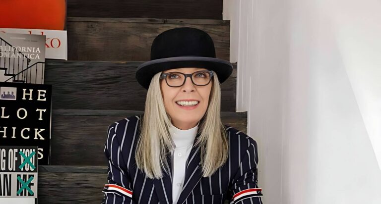 Oscar-winning actress Diane Keaton smiling at a Hollywood event, wearing her signature suit and hat